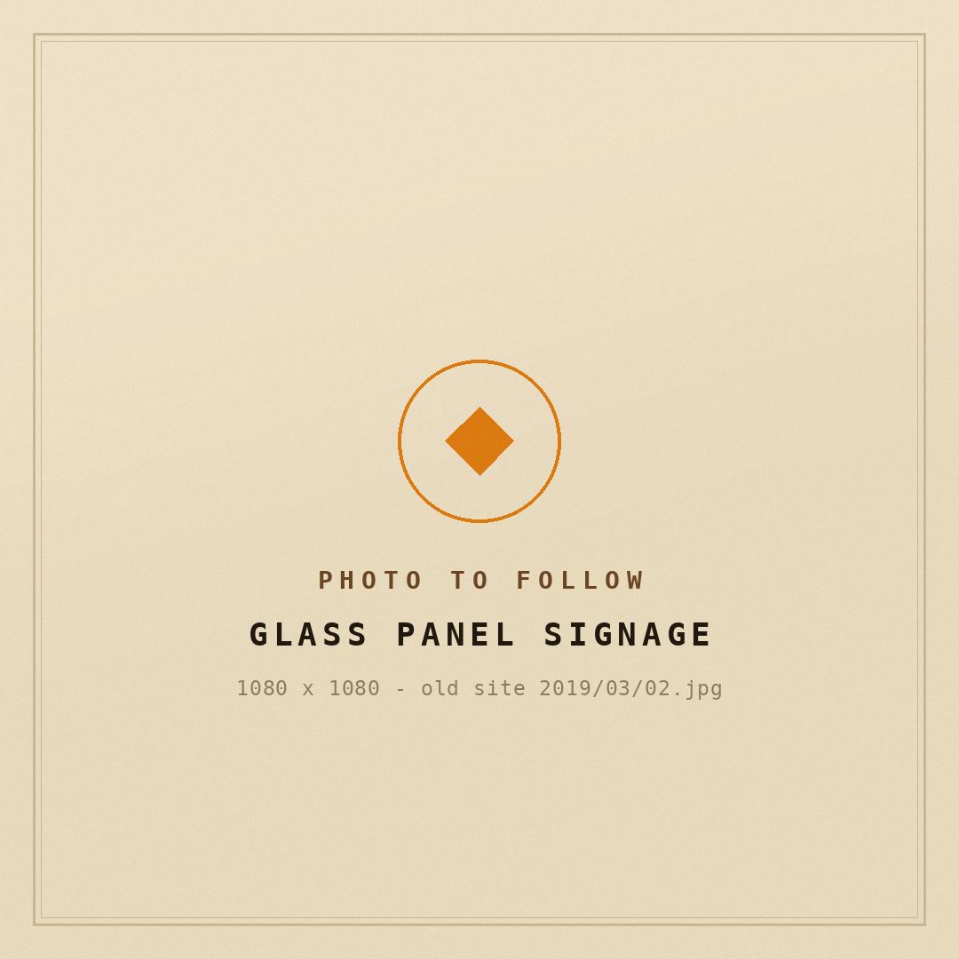 Placeholder for a photograph of glass panel signage