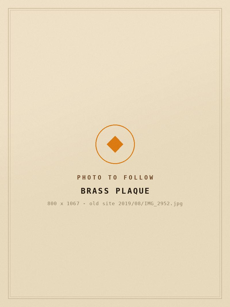 Placeholder for a photograph of an engraved brass plaque